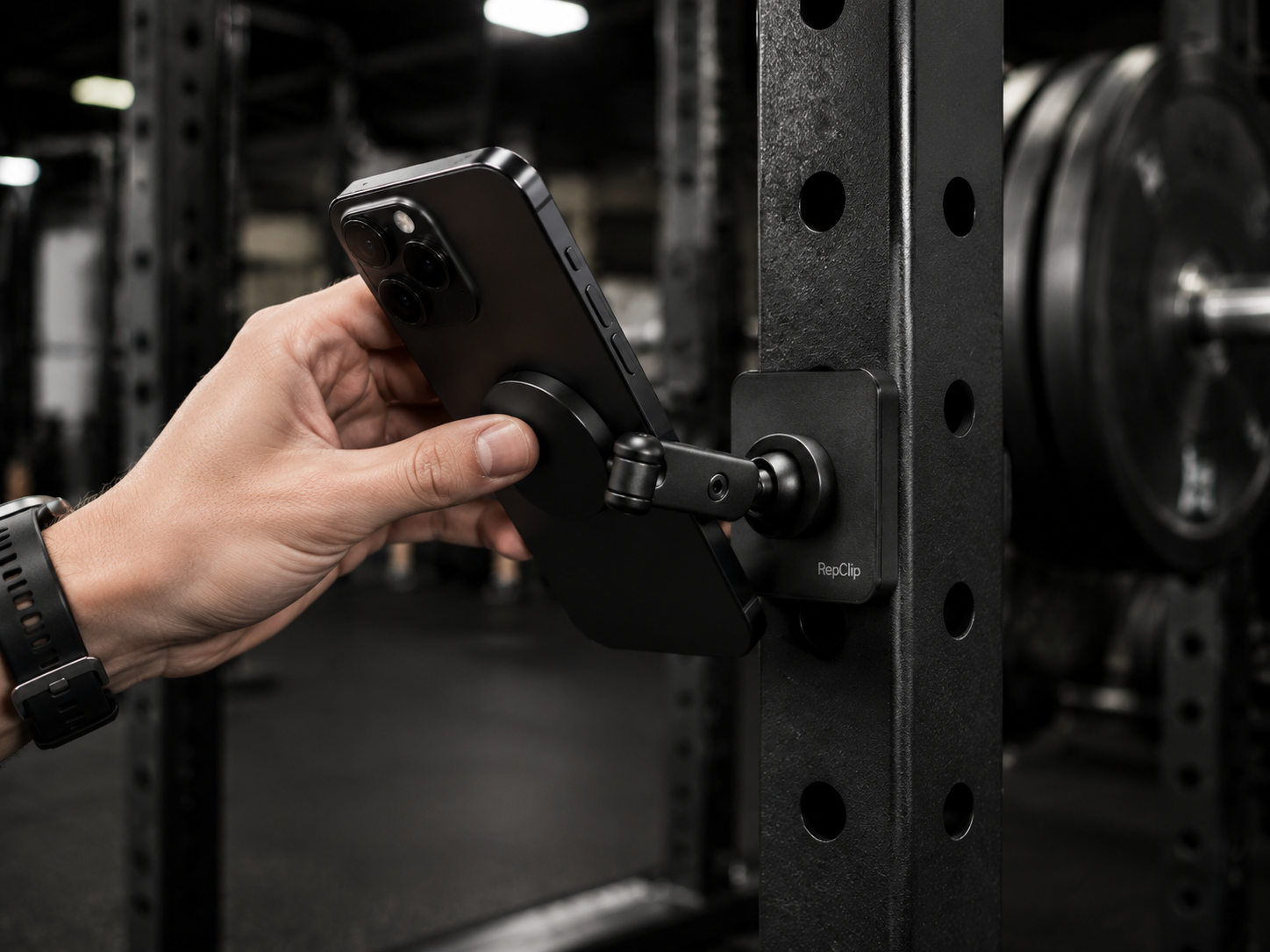 Hand adjusting the phone angle on the RepClip mount