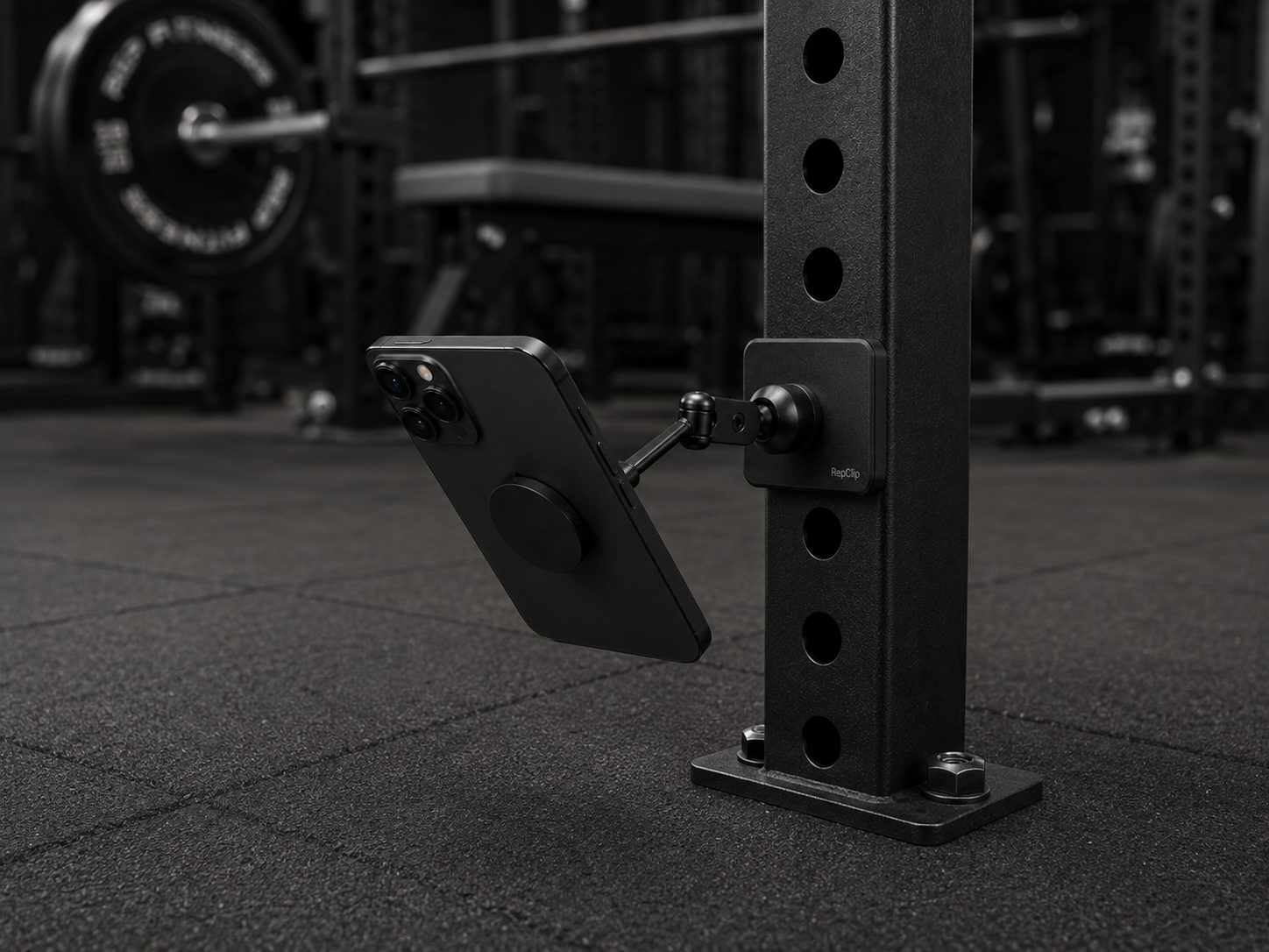 RepClip mounted low on a rack upright in a gym